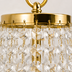 Lustre Empire en cristal doré Compiègne, détail des perles en cascade